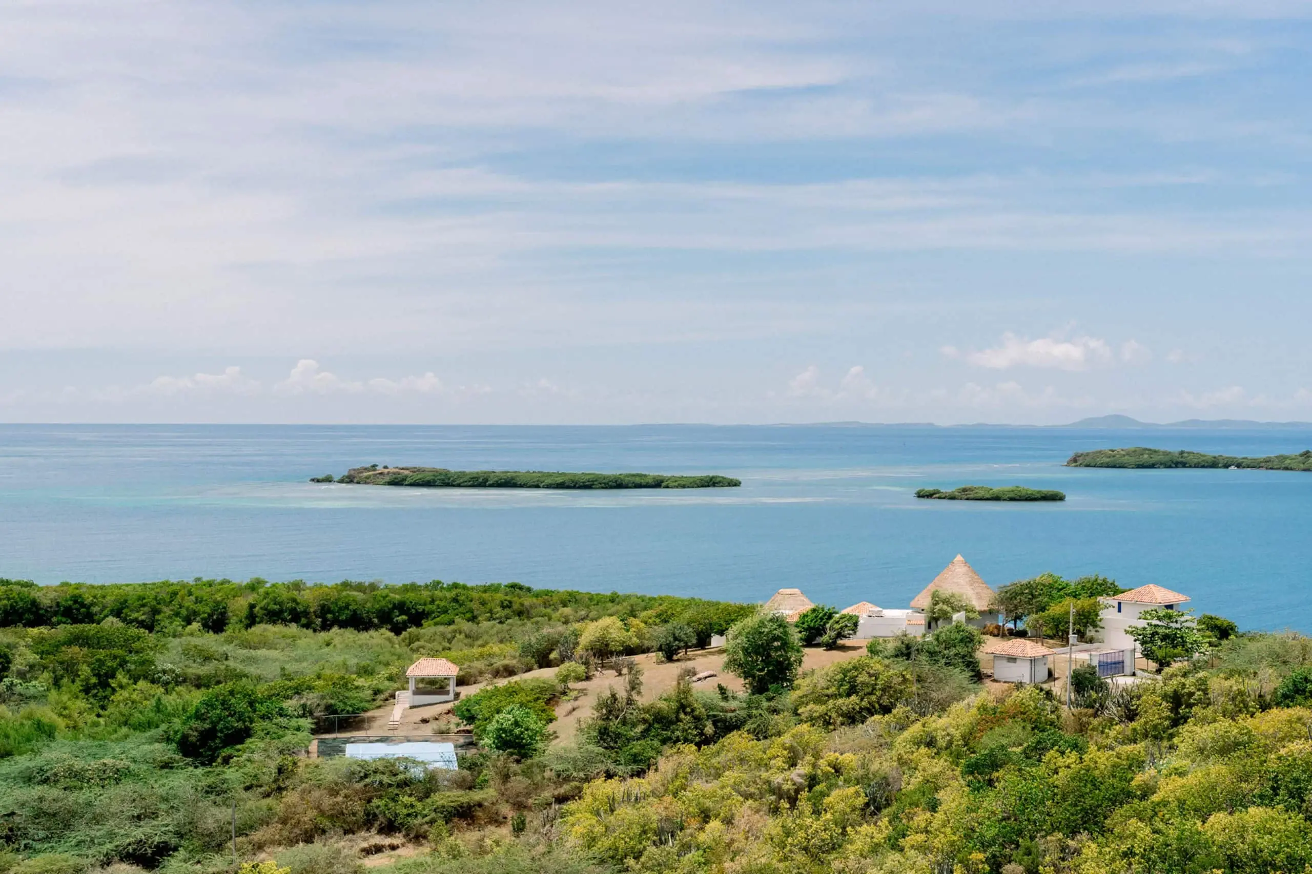 Ocean and offshore islands beyond the green landscape